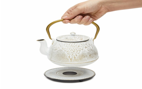 white and gold tea kettle