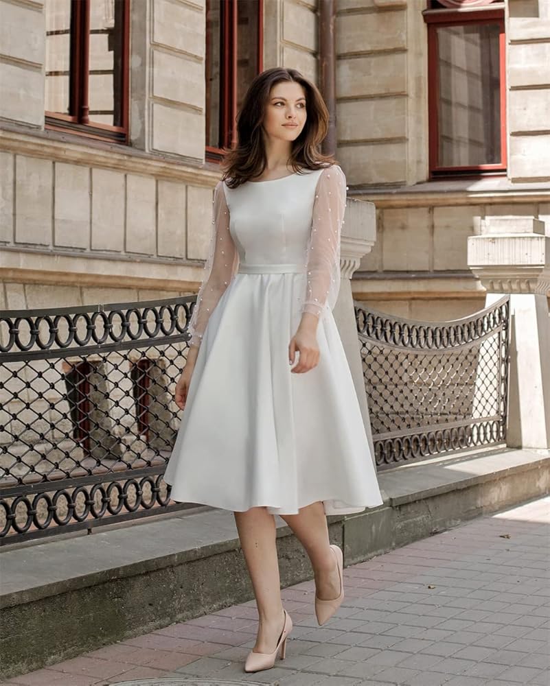 white tea length dress with sleeves