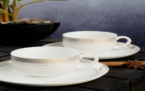 white and gold tea cups