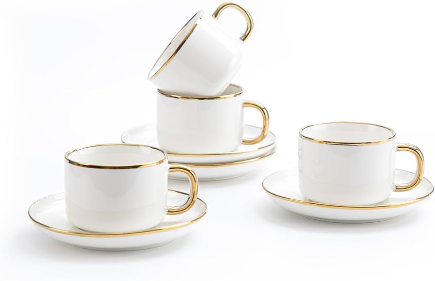 white tea cups with gold trim